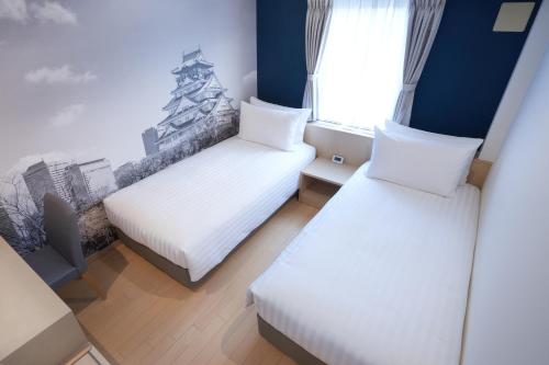 Habitación Doble Deluxe - 2 camas del hotel Travelodge Honmachi Osaka. Foto 2
