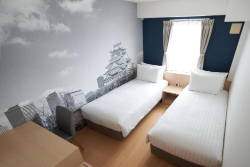 Habitación Doble Deluxe - 2 camas del hotel Travelodge Honmachi Osaka. Foto 3