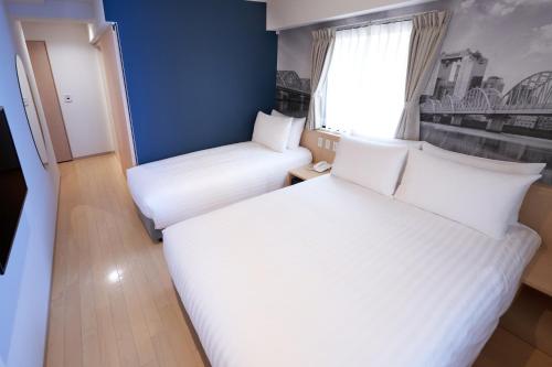 Habitación Familiar del hotel Travelodge Honmachi Osaka. Foto 1