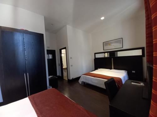 Habitación Cuádruple del hotel Lh Excel Roma Montemario