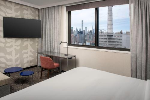 Estudio con sofá cama y vistas a la ciudad - 1 cama extragrande del hotel Residence Inn By Marriott New York Queens. Foto 3