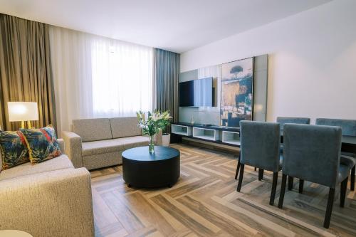 One Bedroom Executive Suite - 15% off on F&B shuttle to Deira City Center, Al Ghurair Mall & La Mer Beach del hotel Khalidia Palace Dubai. Foto 12