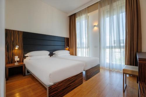 Habitación Doble Económica - 2 camas - Dependance del hotel IH Hotels Milano Centrale. Foto 2