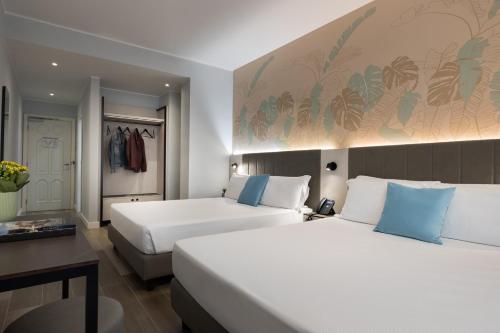 Habitación Doble Superior con 2 camas grandes del hotel IH Hotels Milano Centrale. Foto 1