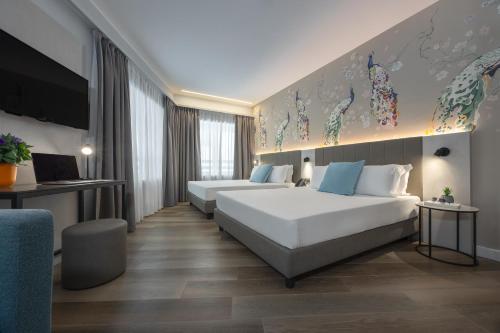 Habitación Doble Superior con 2 camas grandes del hotel IH Hotels Milano Centrale. Foto 9