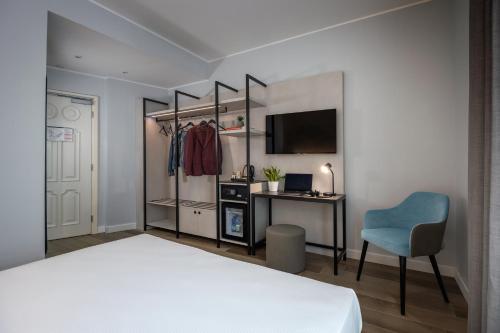 Habitación Doble Estándar del hotel IH Hotels Milano Centrale. Foto 11