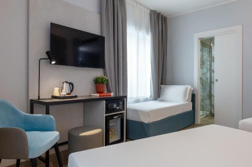 Habitación Doble Familiar del hotel IH Hotels Milano Centrale. Foto 4