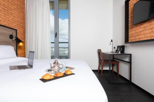 Habitación Doble con vistas al jardín del hotel ONOMO Casablanca Airport. Foto 5