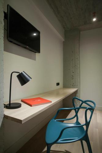 Habitación Familiar con bañera del hotel Art Suites Korai. Foto 1