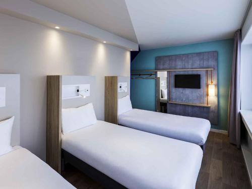 3 camas individuales del hotel Ibis Budget Amsterdam City South