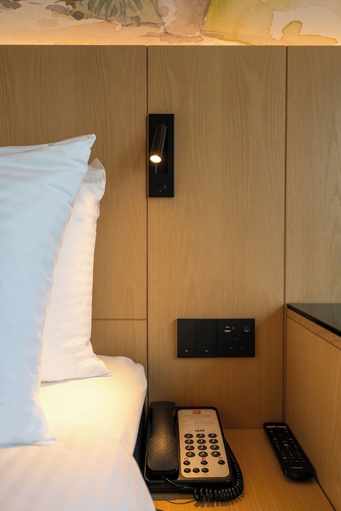 Habitación Deluxe con cama Queen del hotel Ibis Singapore On Bencoolen. Foto 9