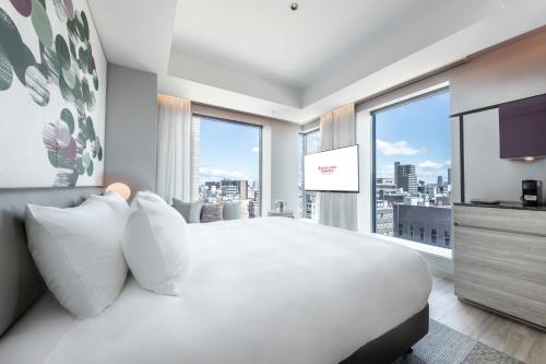 Habitación familiar - Planta Premium del hotel Centara Grand Osaka. Foto 1