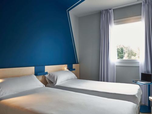 Habitación Doble Estándar - 2 camas del hotel Ibis budget Vitoria Gasteiz. Foto 13