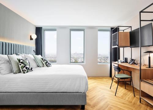 Habitación Superior con cama extragrande del hotel H4 Wyndham Paris Pleyel Resort. Foto 4