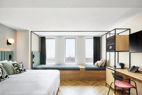 Habitación triple familiar del hotel H4 Wyndham Paris Pleyel Resort. Foto 5
