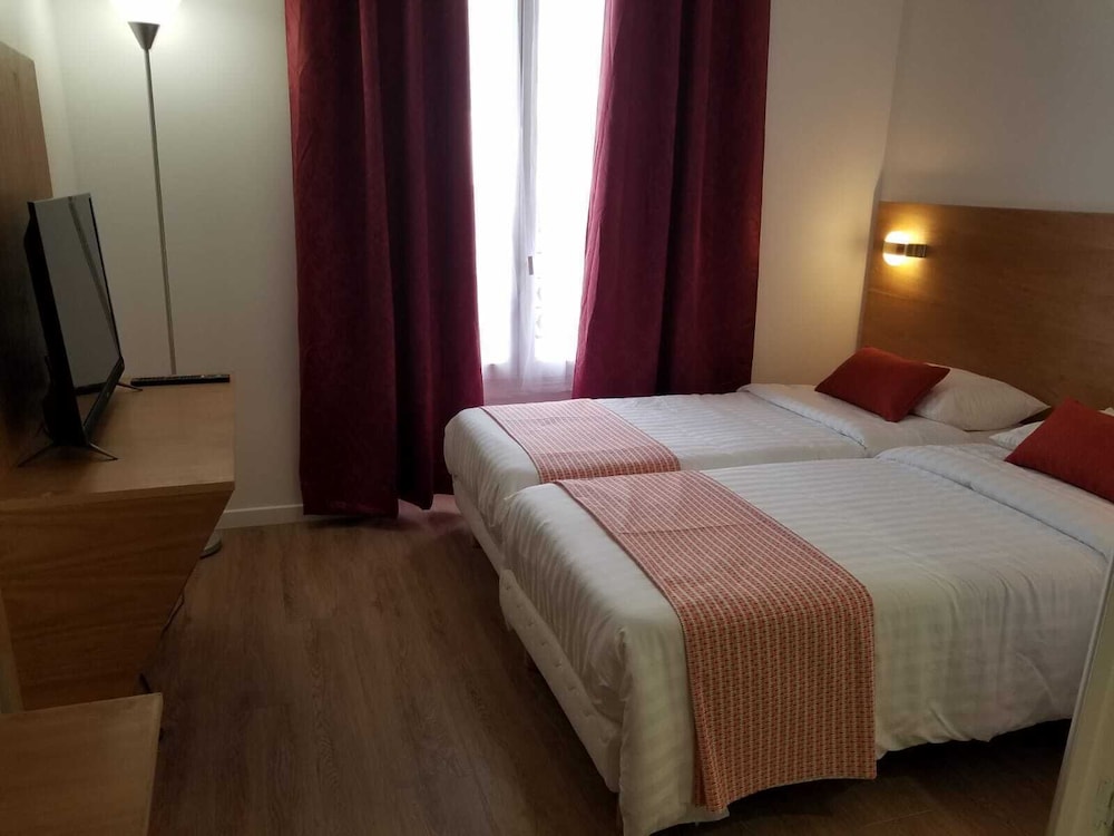 Habitación estándar con 2 camas individuales del hotel Dupleix. Foto 1