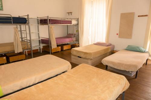 Cama en habitación compartida mixta - 12 camas del hotel La Casa Encantada. Foto 3