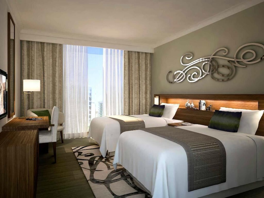 Apartamento de 2 dormitorios, 1 cama king size y 2 camas individuales, vistas al arroyo del hotel Pullman Dubai Creek City Centre Residences. Foto 5