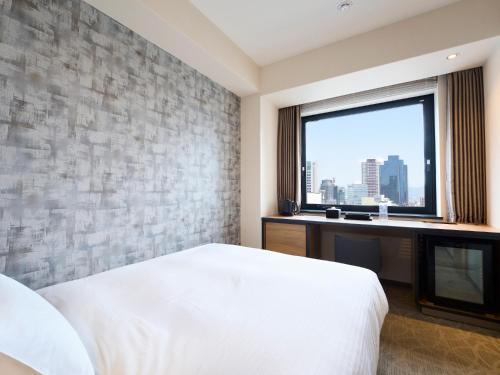 Habitación Doble con cama doble pequeña y acceso al salón - No fumadores del hotel Elcient Osaka. Foto 2