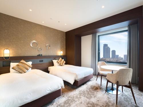 Habitación Doble Superior con acceso al salón - 2 camas - No fumadores del hotel Elcient Osaka. Foto 4