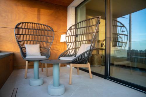 Habitación Doble Deluxe con vistas al mar del hotel TenSuites. Foto 8