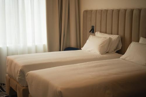 Habitación doble con 2 camas Tribe Essential del hotel Tribe Milano Malpensa. Foto 13
