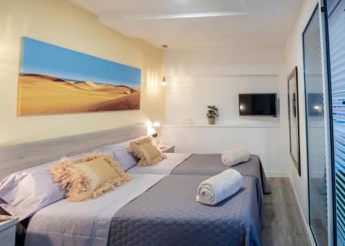 Suite con terraza del hotel La Palmera Hotel Boutique. Foto 1