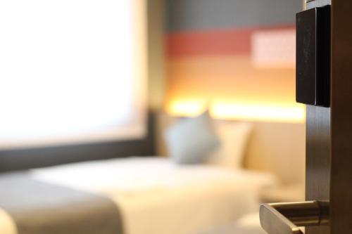 Habitación con cama extragrande. del hotel KOKO Tsukiji Ginza