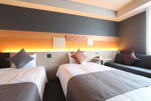 Habitación Doble Moderate con sofá cama - 2 camas del hotel KOKO Tsukiji Ginza. Foto 1