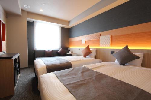 Habitación Doble Moderate con sofá cama - 2 camas del hotel KOKO Tsukiji Ginza. Foto 2
