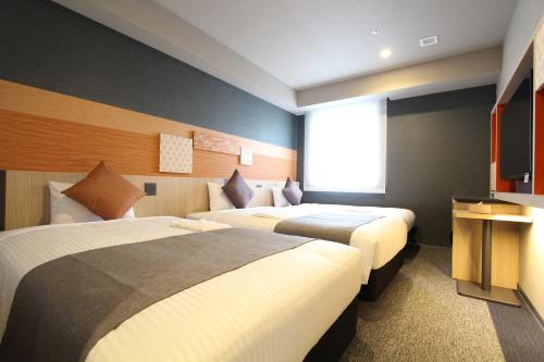 Habitación Doble Moderate con sofá cama - 2 camas del hotel KOKO Tsukiji Ginza. Foto 4