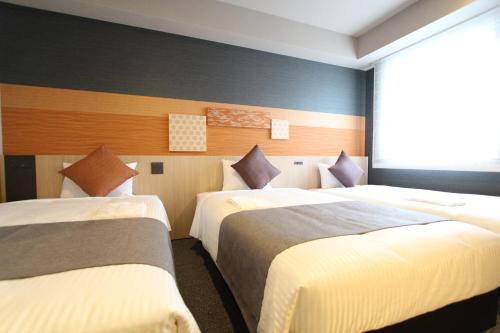 Habitación Doble Moderate con sofá cama - 2 camas del hotel KOKO Tsukiji Ginza. Foto 5