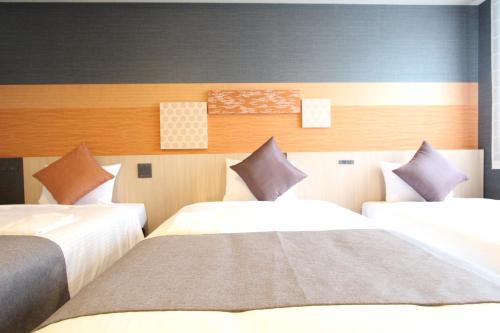Habitación Doble Moderate con sofá cama - 2 camas del hotel KOKO Tsukiji Ginza. Foto 6