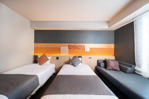 Habitación Doble Moderate con sofá cama - 2 camas del hotel KOKO Tsukiji Ginza. Foto 12
