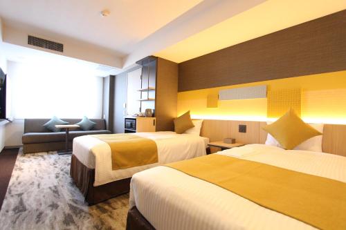 Habitación Doble Deluxe - 2 camas del hotel KOKO Tsukiji Ginza. Foto 1
