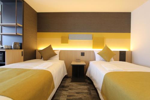 Habitación Doble Deluxe - 2 camas del hotel KOKO Tsukiji Ginza. Foto 4