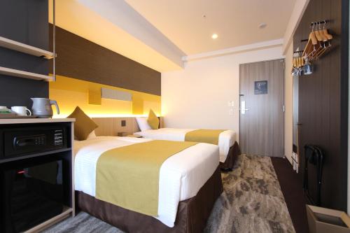 Habitación Doble Deluxe - 2 camas del hotel KOKO Tsukiji Ginza. Foto 5