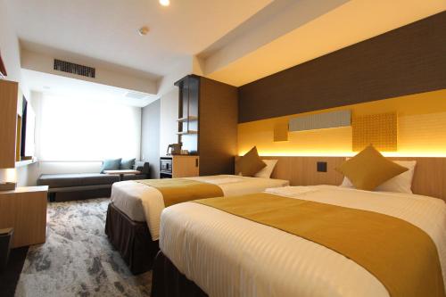 Habitación Doble Deluxe adaptada para personas con movilidad reducida - 2 camas del hotel KOKO Tsukiji Ginza