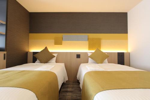 Habitación Doble Deluxe adaptada para personas con movilidad reducida - 2 camas del hotel KOKO Tsukiji Ginza. Foto 1