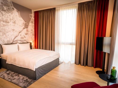 Habitación Doble Deluxe del hotel IntercityHotel Geneva. Foto 2