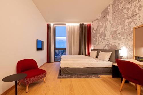 Habitación Doble adaptada para personas con movilidad reducida del hotel IntercityHotel Geneva. Foto 1
