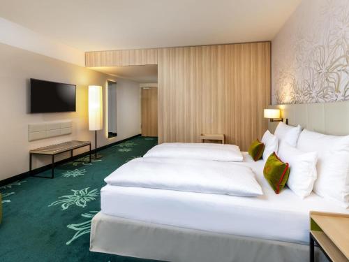 Family Queen Room - Two Connecting Rooms del hotel Mövenpick Stuttgart Messe and Congress. Foto 2