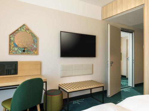 Family Queen Room - Two Connecting Rooms del hotel Mövenpick Stuttgart Messe and Congress. Foto 5