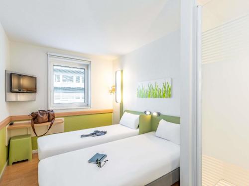 Habitación Triple del hotel ibis budget Zurich City West. Foto 2