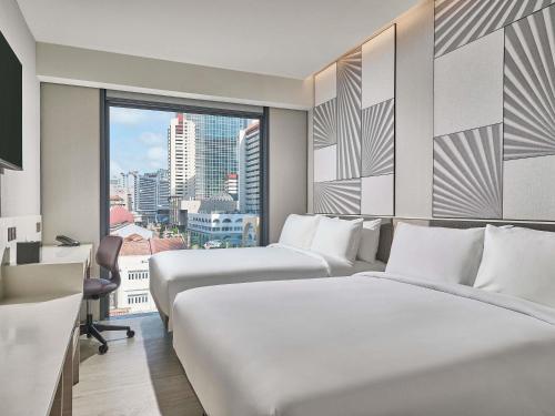 Habitación Doble Deluxe - 2 camas dobles del hotel Mercure ICON Singapore City Centre