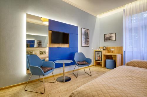Triple Room with Garden or Patio View del hotel Salvator Boutique. Foto 1