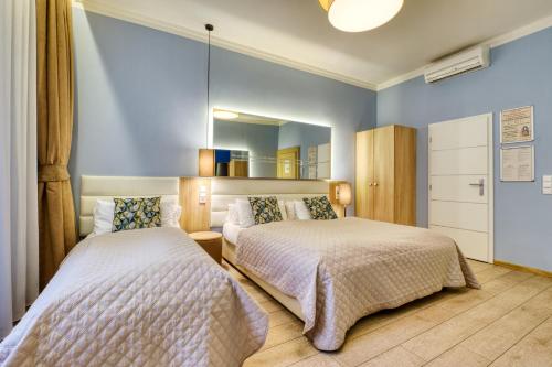 Triple Room with Garden or Patio View del hotel Salvator Boutique. Foto 2