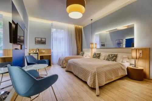 Triple Room with Garden or Patio View del hotel Salvator Boutique. Foto 3