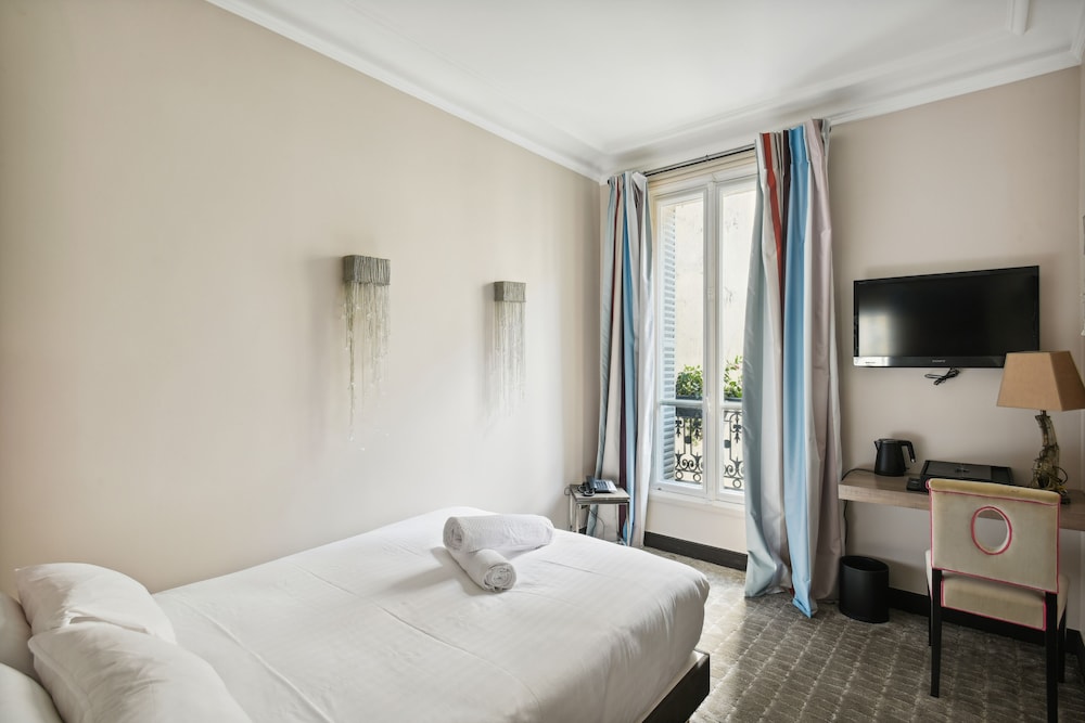 Habitación clásica del hotel Le Paris Singulier