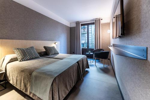 Habitación Doble Estándar - 1 o 2 camas del hotel Raval House. Foto 8